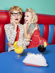 Excited girl with a bored nerdy guy