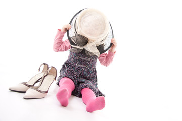 Child playing dress up isolated against white background © ellenamani