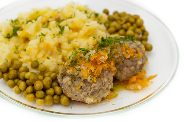 Meatballs with mashed potatoes and peas on white background