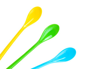 bright plastic spoons isolated on white