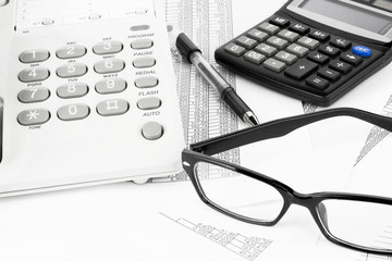 calculator and pen on a business background