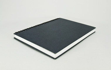 stack of ring binder book or black notebook