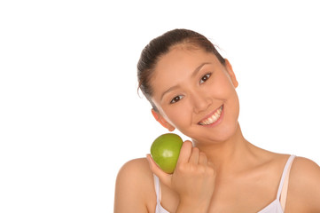 smiling asian woman with green apple
