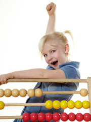 Cute child celebrates her traning success at an abacus