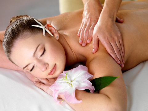 Woman on massage in spa salon