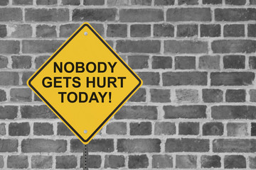 Safety Sign with a Factory Wall in the Background