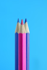 Blue and Pink Pencils on Light Blue Background