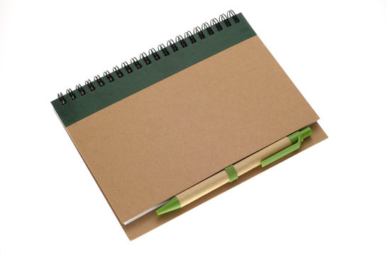 Recycle paper notebook and pen isolated