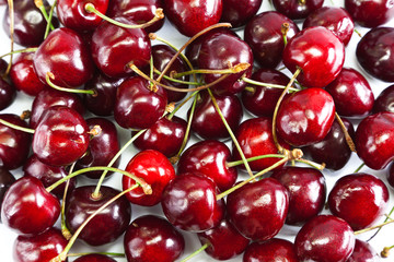 Red Ripe Cherries Laid On White Table