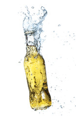 Bottle of cider with splash, isolated on white background