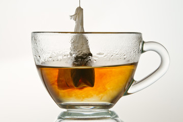 Make a hot tea isolated on white background