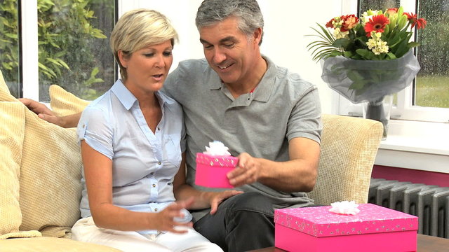 Attractive Mature Female Receiving Birthday Gifts