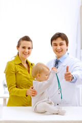 Portraits of baby, mother and pediatric doctor showing thumbs up