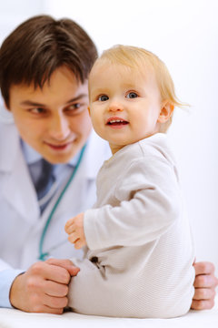 Portrait of baby on examination at pediatrician cabinet