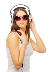 Young girl hear music by headphones