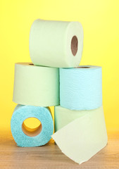green and blue rolls of toilet paper