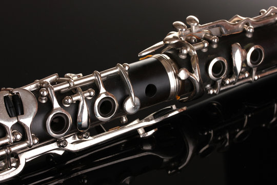 close up detail of clarinet on black background