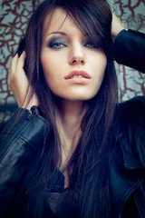 Fototapeta premium closeup woman portrait over cracked wall