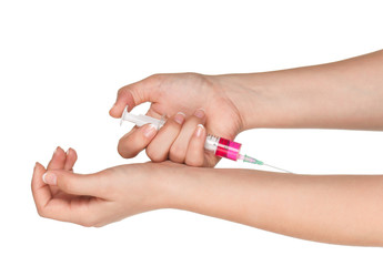 Hand with syringe