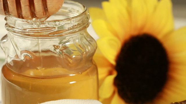 Breakfast - Honey dripping on glass container