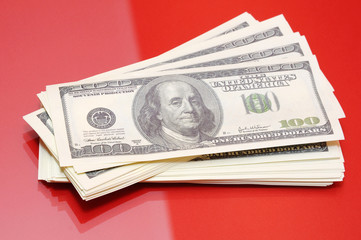 Dollars on red background