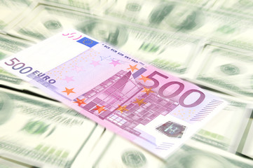 Euro banknote lying on the dollars background