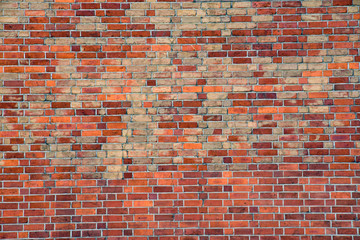 Old worn red brickwall