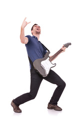 guitarist making a rock and roll gesture