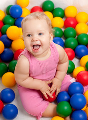 Fototapeta na wymiar pretty baby with color educational toy