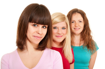 Three women brunette, blonde and redhead in a row