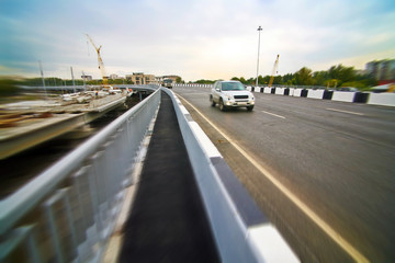 car going on the new bridge in a city