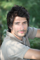 portrait of a young man in woods