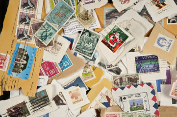 Fototapeta na wymiar Collection of mixed postage used stamps
