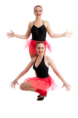 Two smiling female dancers