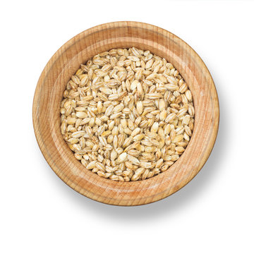 Pearl barley in wood plate