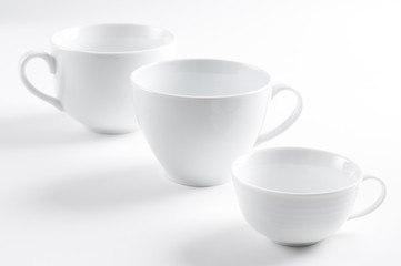Three different white cups