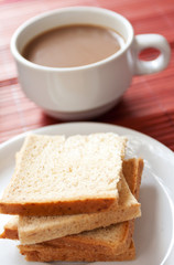 Fototapeta na wymiar A cup of coffee and bread