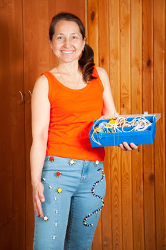 Mature woman  shows beaded jeans