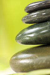 Spa Massage Hot Stones With Green Background