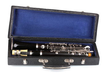 Antique clarinet in case isolated on white