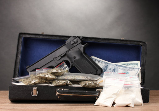 Cocaine, marijuana dollars and handgun in case