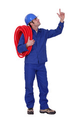Plumber pointing upwards