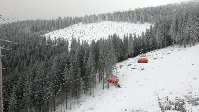 Chairlift in snowy winter mountains