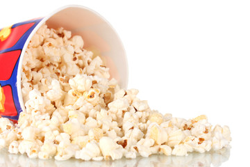 Full bucket of popcorn dropped isolated on white