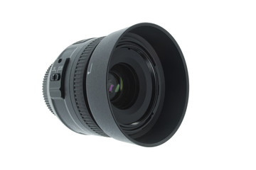 A 35mm camera lens with hood isolated on a white background
