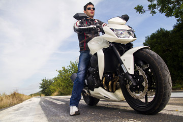 Fototapeta na wymiar man with a motorcycle