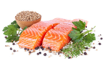 two slices trout fillet whith spices isolated on white