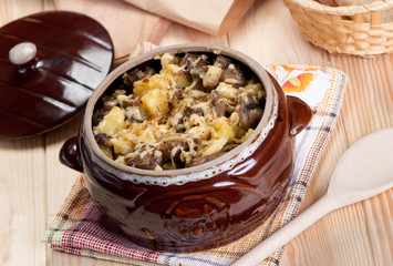 Potato casserole with mushrooms and cheese.