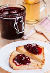Strawberry jam on bread toasts.