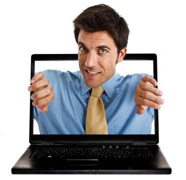 Man coming out from behind the laptop